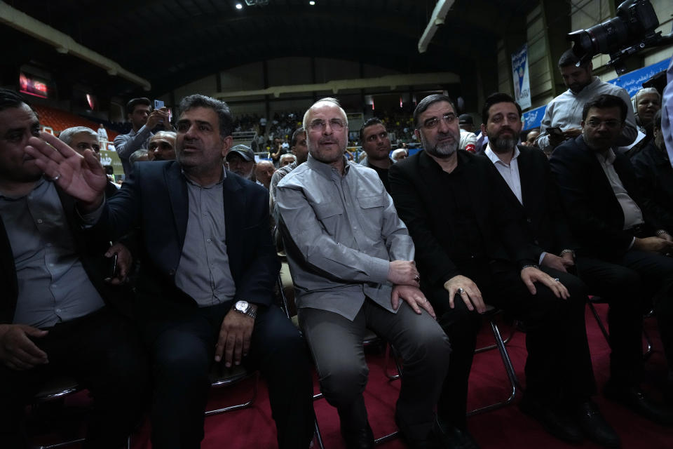 Mohammad Bagher Qalibaf, center, the most prominent candidate for the June 28, presidential election, who is Iran's parliament speaker, sits, during his campaign rally in Tehran, Iran, Tuesday, June 18, 2024. (AP Photo/Vahid Salemi)