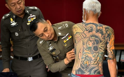 A yakuza gang boss was hunted down by police last year after a picture of his intricate body art was posted to social media and went viral - Credit: Reuters/Reuters