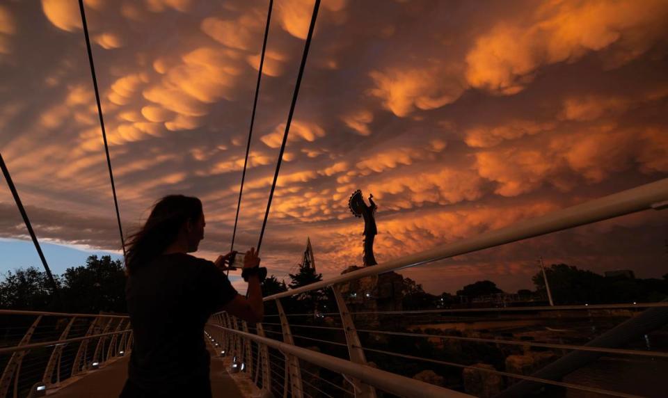 Mammatus clouds cover the Wichita sky at the Keeper of the Plains on Tuesday night after a line of thunderstorms passed through the area.