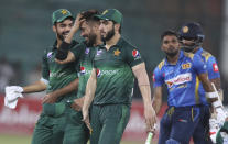 Pakistani players celebrate their victory against Sri Lanka in the second one-day international in Karachi, Pakistan, Monday, Sept. 30, 2019. Pakistan marked return of ODI cricket in Karachi after 10 years with a 67-run victory over Sri Lanka in the second one-day international of the three-match series on Monday. (AP Photo/Fareed Khan)