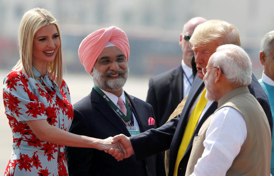 U.S. President Donald Trump greets U.S. White House senior advisor Ivanka Trump next to Indian Prime Minister Narendra Modi as they arrive at Sardar Vallabhbhai Patel International Airport in Ahmedabad, India February 24, 2020. REUTERS/Al Drago