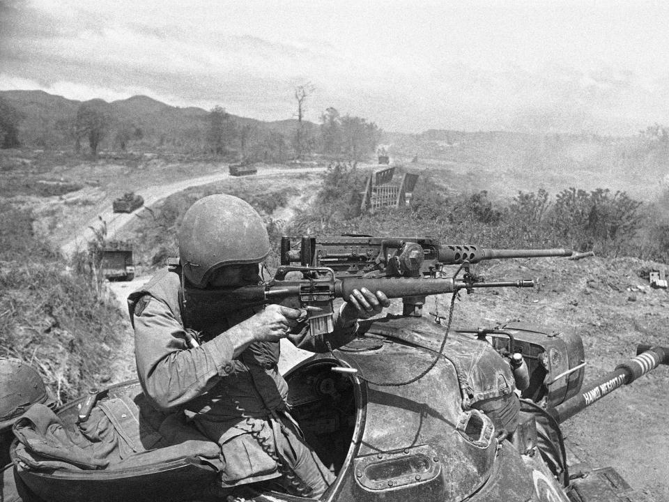 A soldier uses his M16 during a battle in the Vietnam War in 1971.