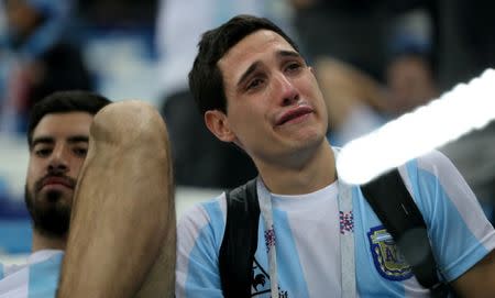 Soccer Football - World Cup - Group D - Argentina vs Croatia - Nizhny Novgorod Stadium, Nizhny Novgorod, Russia - June 21, 2018 Argentina fan looks dejected after the match REUTERS/Ivan Alvarado TPX IMAGES OF THE DAY