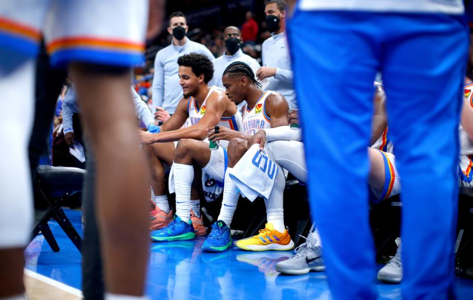 Oklahoma City's Shai Gilgeous-Alexander (2) and Jeremiah Robinson-Earl (50) sit on the bench during a timeout during a 107-102 loss to Cleveland on Saturday.