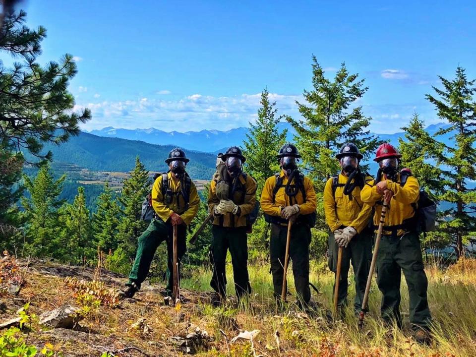 Nolan Buckingham, in red hat, stands with his crew on a spot overlooking the heart of the mine in August 2019. (Courtesy Nolan Buckingham)