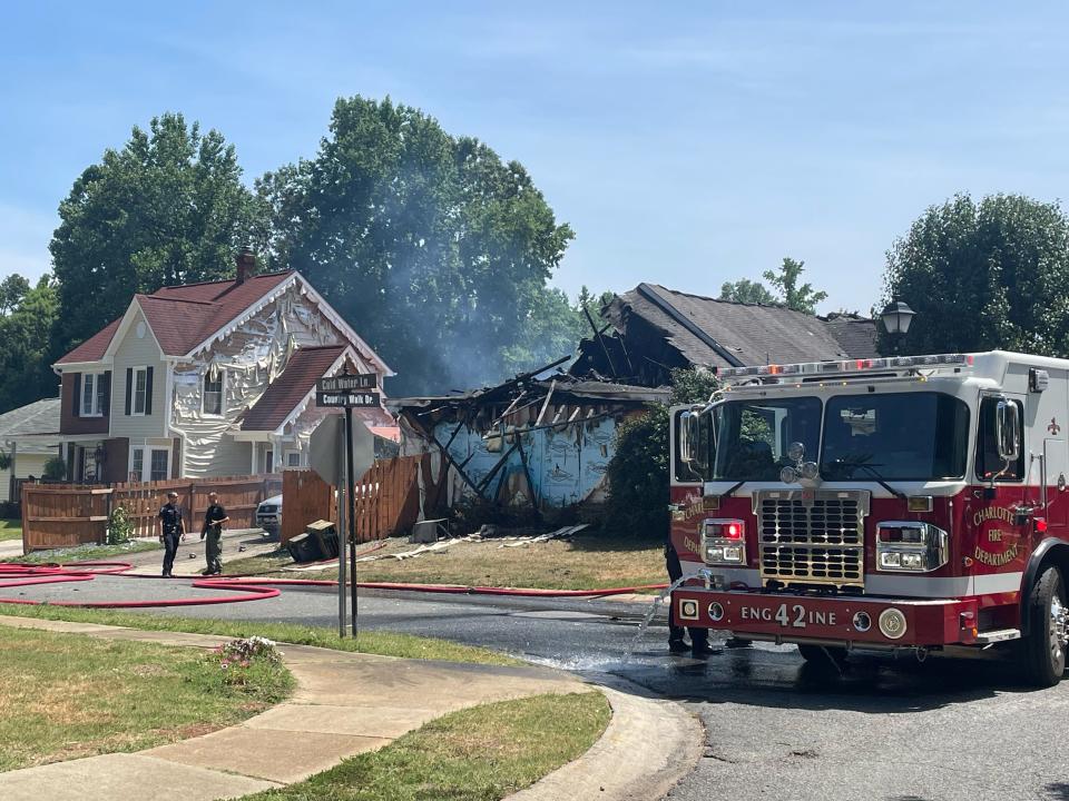 Firefighters battled a blaze at an east Charlotte house Tuesday afternoon that appeared to have completely destroyed the home.
