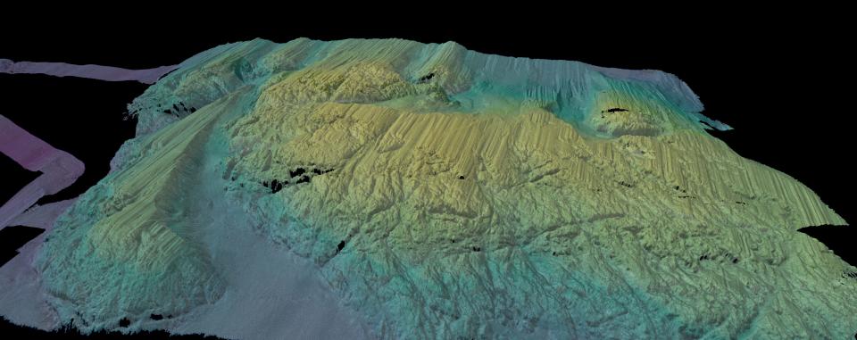 A 3D-rendered view of the multibeam bathymetry (seafloor shape) colored by depth, collected by Ránacross, shows a seabed ridge just in front of Thwaites Ice Shelf.