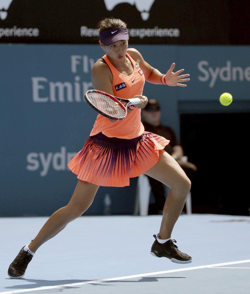 China's Shuai Zhang plays a forehand to Eugenie Bouchard of Canada during their women's singles match at the Sydney International tennis tournament in Sydney, Australia, Sunday, Jan. 8, 2017. (AP Photo/Rick Rycroft)