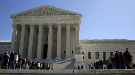 FILE PHOTO: People line up to visit the U.S. Supreme Court in Washington, DC, U.S., March 29, 2016.   REUTERS/Gary Cameron/File Photo