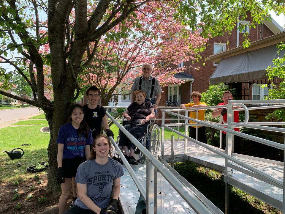 Jackson High School seniors Ethan Chambers, Brian McAuliffe, Ian Nonnamaker, Jayden Oreto and Naomi Torgler donated their time during the school's annual service day to spruce up the landscaping around George and Jerri Helmreich's Massillon home.