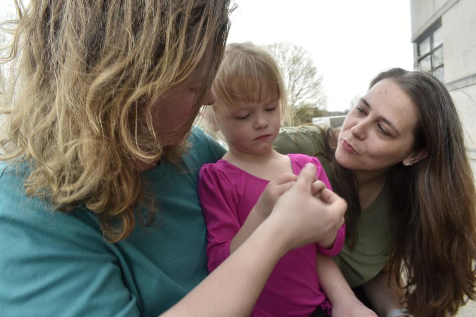 Four-year-old Virginia Bowman with her dad, Calvin Bowman, and her aunt, Kayla Bowman, after gymnastics class in Spencer.