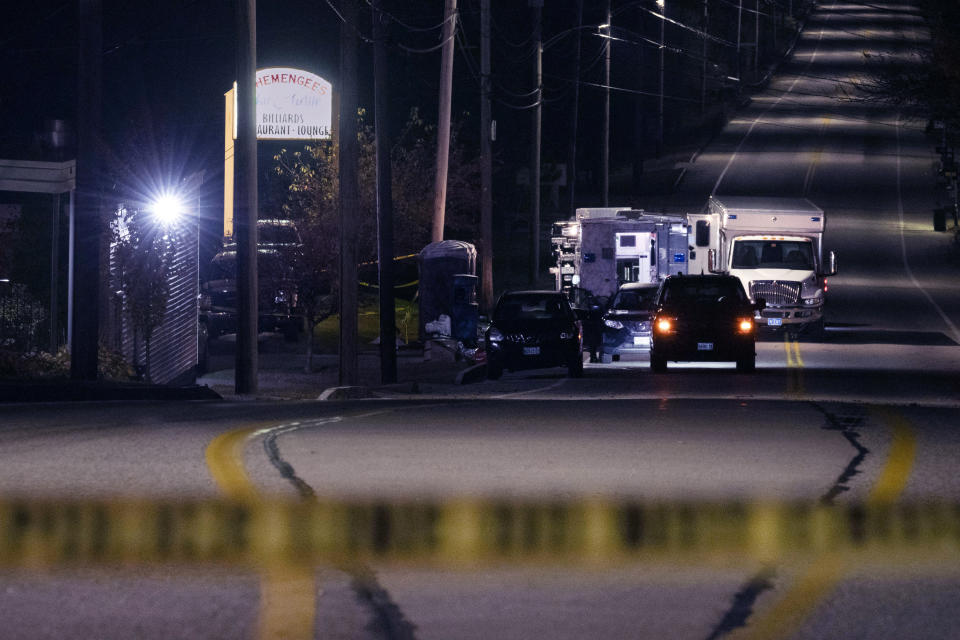 FILE - Police tape cordons off the road to Schemengees Bar and Grille as law enforcement officers maintain their presence in the aftermath of a mass shooting by Army reservist Robert Card in Lewiston, Maine, Oct. 27, 2023. Despite the warning by Card's friend and fellow Army reservist Sean Hodgson, which came alongside a series of other glaring red flags, Army officials discounted the warnings and ultimately did not stop Card from committing Maine's deadliest mass shooting when he killed 18 people in Lewiston. (AP Photo/Matt Rourke, File)