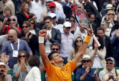 Novak Djokovic of Serbia reacts after defeating Rafael Nadal of Spain during their semi-final match at the Monte Carlo Masters in Monaco April 18, 2015. REUTERS/Jean-Paul Pelissier