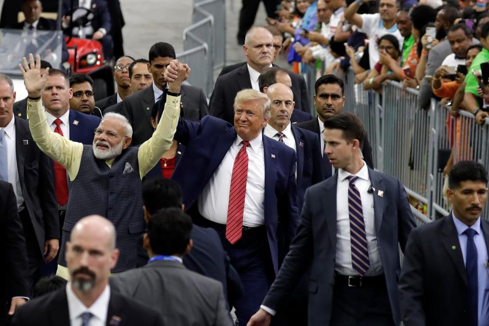 President Donald Trump and Indian Prime Minister Narendra Modi walk around NRG Stadium waving to the crowd during the "Howdy Modi: Shared Dreams, Bright Futures" event, Sunday, Sept. 22, 2019, in Houston.