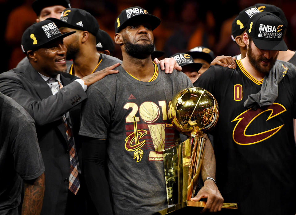 Jun 19, 2016; Oakland, CA, USA; Cleveland Cavaliers forward LeBron James (23) celebrates with the Larry O'Brien Championship Trophy after beating the Golden State Warriors in game seven of the NBA Finals at Oracle Arena. Mandatory Credit: Bob Donnan-USA TODAY Sports TPX IMAGES OF THE DAY