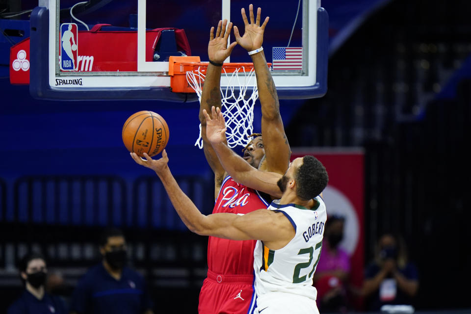 Utah Jazz's Rudy Gobert, right, goes up for a shot against Philadelphia 76ers' Dwight Howard during the first half of an NBA basketball game, Wednesday, March 3, 2021, in Philadelphia. (AP Photo/Matt Slocum)