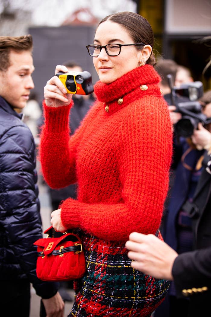 Shailene holding up a disposable camera
