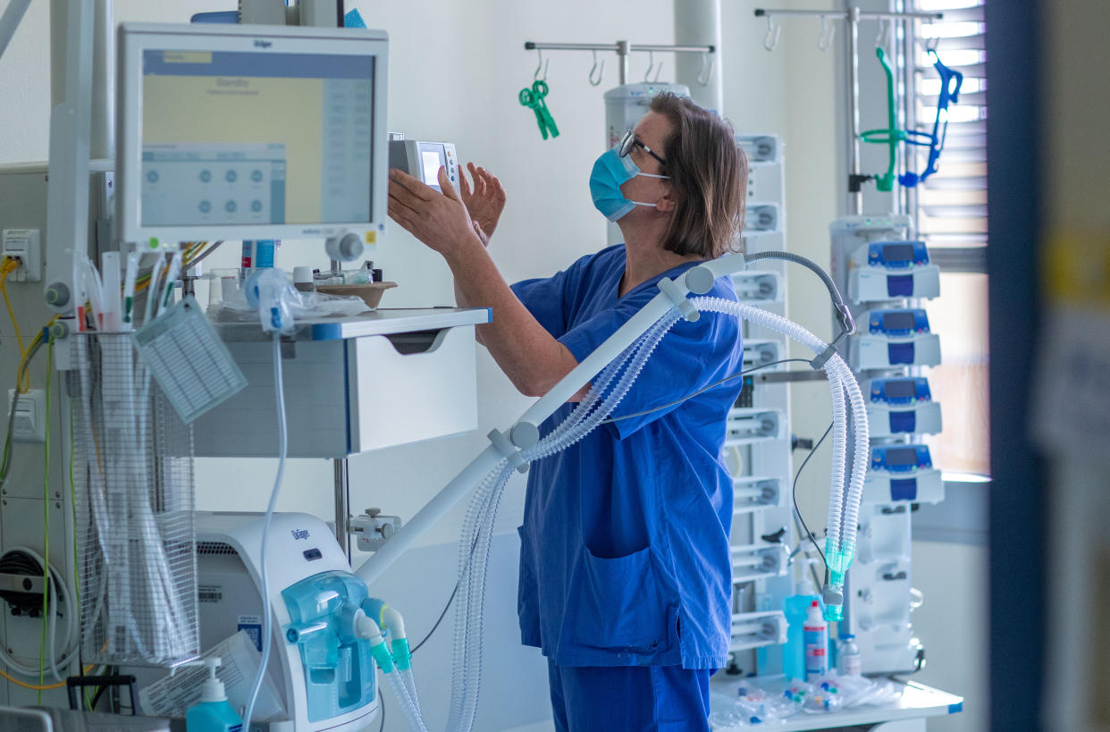 26 March 2020, Mecklenburg-Western Pomerania, Schwerin: Nurse Cornelia Möller checking a ventilator in a room of the intensive care unit at the Helios Clinic. In the isolation wards, the doctors, nurses and staff wear protective suits, glasses and face masks. The Helios Klinikum is preparing for an increase in corona cases. Photo: Jens Büttner/dpa-Zentralbild/dpa (Photo by Jens Büttner/picture alliance via Getty Images)