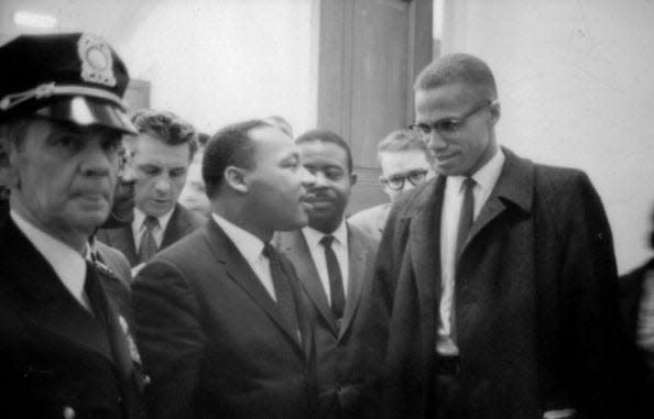 Martin Luther King Jr. and Malcolm X wait for a news conference on March 26, 1964.