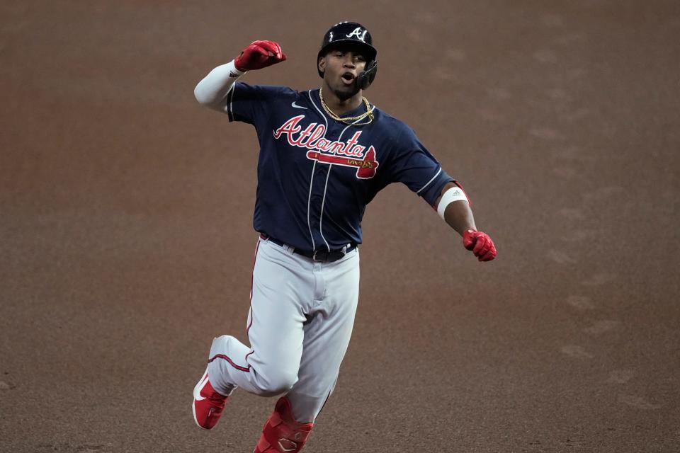 Atlanta Braves' Jorge Soler celebrates his home run during the first inning of Game 1 in baseball's World Series between the Houston Astros and the Atlanta Braves Tuesday, Oct. 26, 2021, in Houston. (AP Photo/Eric Gay)