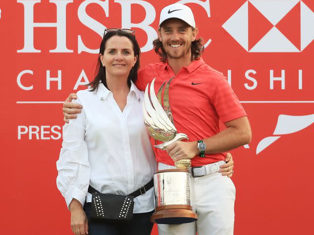 <p>Matthew Lewis/Getty </p> Tommy Fleetwood with his wife Claire Fleetwood at the Abu Dhabi HSBC Golf Championship in January 2018.