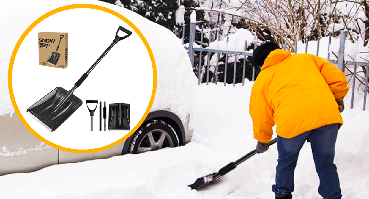 man with shovel in the snow shovelling car out of snow bank