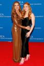 <p>have a <a href="https://people.com/style/brooke-shields-poses-with-daughter-rowan-at-white-house-correspondents-dinner/" rel="nofollow noopener" target="_blank" data-ylk="slk:stylish mother-daughter date night;elm:context_link;itc:0;sec:content-canvas" class="link ">stylish mother-daughter date night</a> wearing a dazzling copper-colored floor-length gown and a black slip dress and pink heels, respectively. </p>