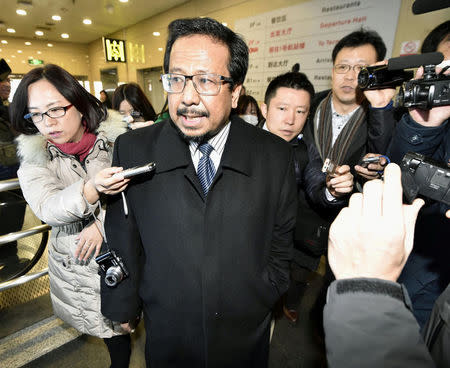 Malaysia's ambassador to North Korea Mohamad Nizan Mohamad (C) is surrounded by media upon his arrival from Pyongyang, after being recalled by Malaysian government, at Beijing airport in Beijing, China, in this photo taken by Kyodo February 21, 2017. Mandatory credit Kyodo/via REUTERS