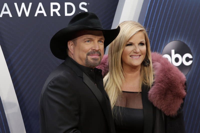 Trisha Yearwood, seen with Garth Brooks, will perform a new song from her new album at the CMT Music Awards. File Photo by John Angelillo/UPI