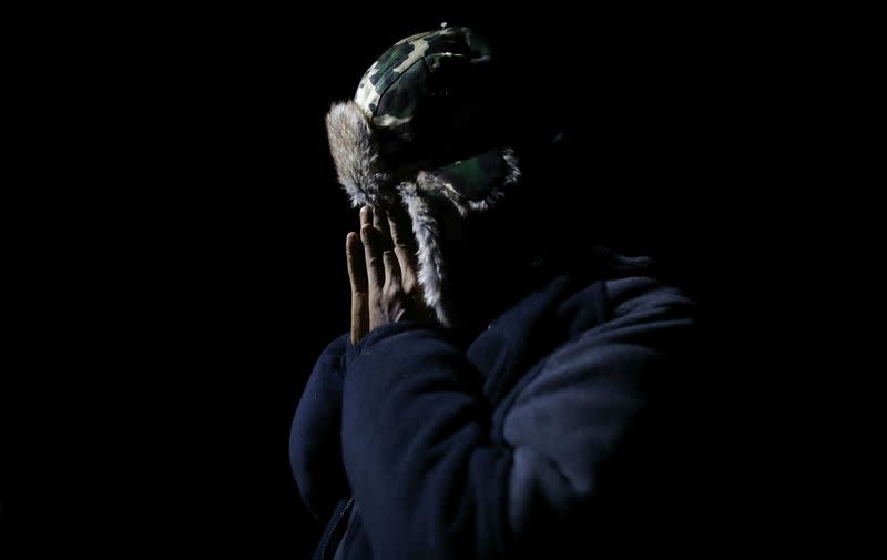 Mohamed, 26, migrant from Yemen gestures during an interview with Reuters after he crossed Belarusian-Polish border in the woods near Sokolka