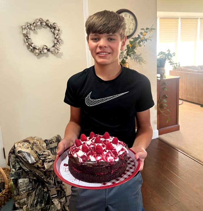 Miles, 15, holds his birthday cake. (Image courtesy Make-A-Wish Greater Bay Area)