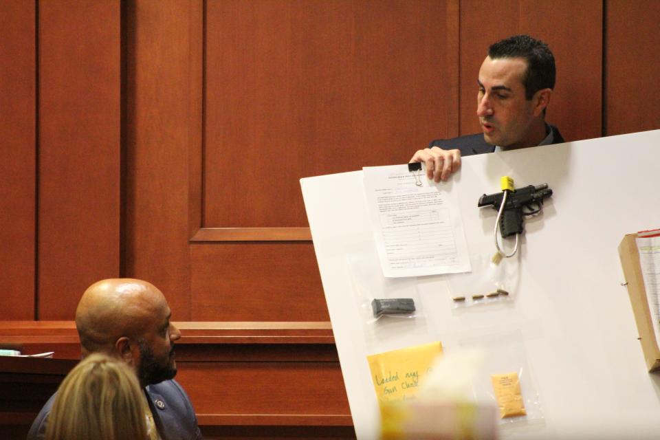 Assistant State Attorney Jason Lewis during a trial Friday asks a Daytona Beach police detective questions about the gun investigators said Marcus Pinckney used to shoot three men.