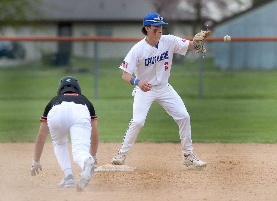 Carlinville's Henry Kufa takes a throw for a force out against Gillespie on Tuesday, April 25, 2023.