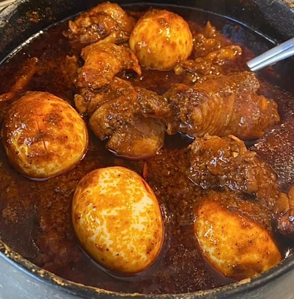 Doro wot, a spicy chicken stew with niter kibbeh (Ethiopian clarified butter), boiled egg and injera at Ada's Gojjo in Asbury Park.