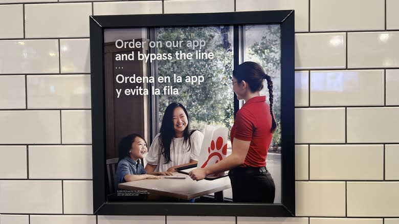 Sign advertising Chick-fil-A app