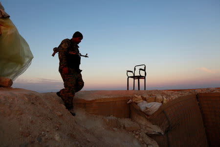 A Popular Mobilisation Forces (PMF) fighter near the Iraqi-Syrian border in al-Qaim, Iraq, November 27, 2018. REUTERS/Alaa al-Marjani