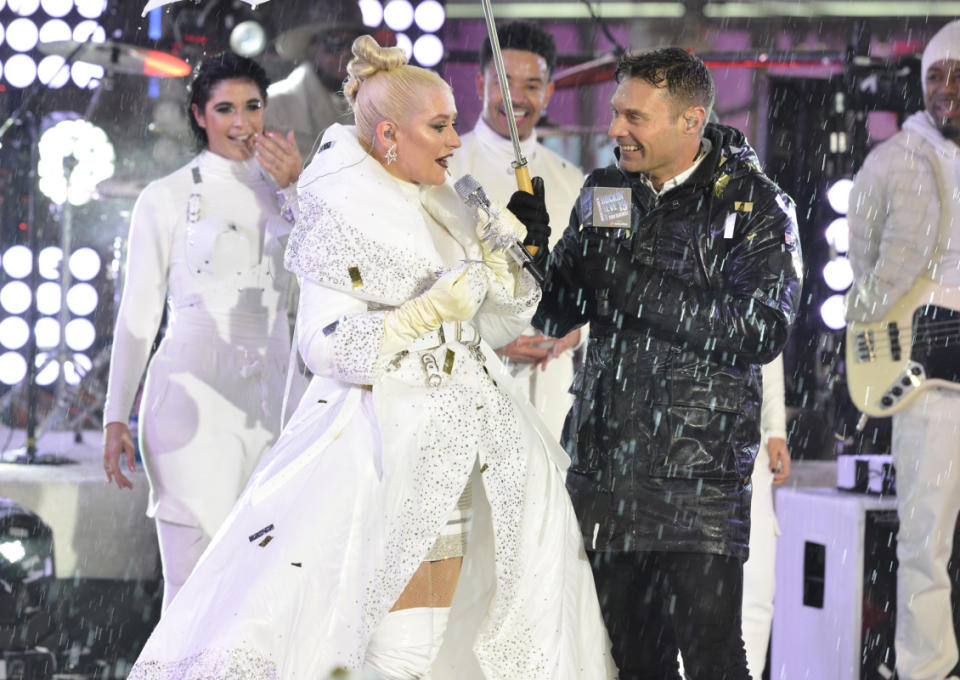 <p>ABC/Pawel Kaminski</p><p>Hosting duties don’t stop, rain or shine. (With Christina Aguilera.) </p>