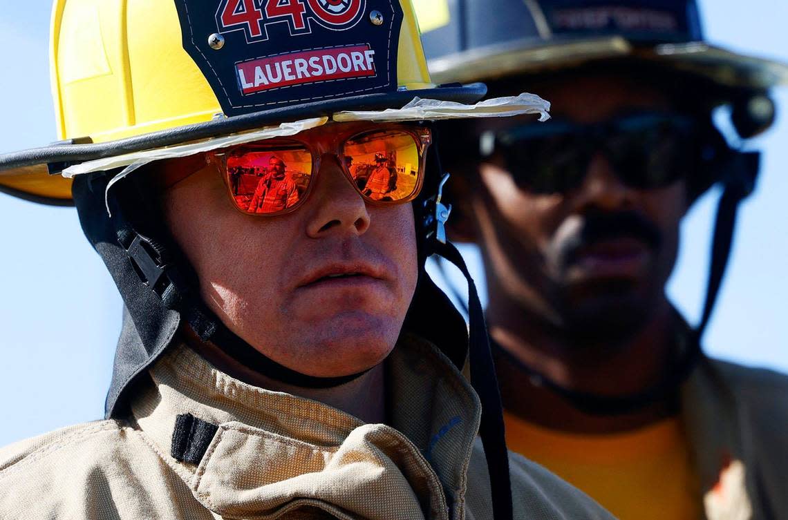 Fort Worth District 4 City Councilmember Charles Lauersdorf listens as members of the Fort Worth Fire Department explain how they extract victims from car crash vehicles on Friday. City officials were invited to participate in a training session to learn what firefighters face on a day-to-day basis. Amanda McCoy/amccoy@star-telegram.com