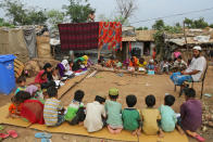 <p>Rohingya refugee children attend a Madrassa, or Islamic religious school in a temporary shelter on the outskirts of Jammu, India, Tuesday, June 20, 2017. Facing persecution in Myanmar, thousands of members of Myanmar’s minority Rohingya community have crossed over to India over the past years. Tuesday marks World Refugee Day. (Photo: Channi Anand/AP) </p>