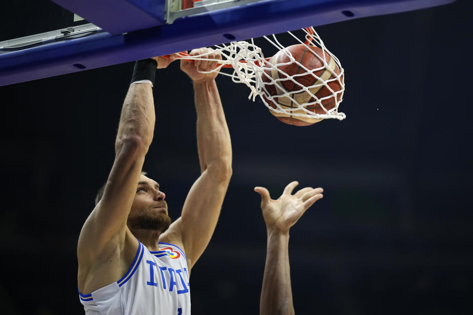 Italy guard Stefano Tonut (7) dunks the ball during their Basketball World Cup second round match against Italy at the Araneta Coliseum, Manila, Philippines on Sunday Sept. 3, 2023. (AP Photo/Aaron Favila)