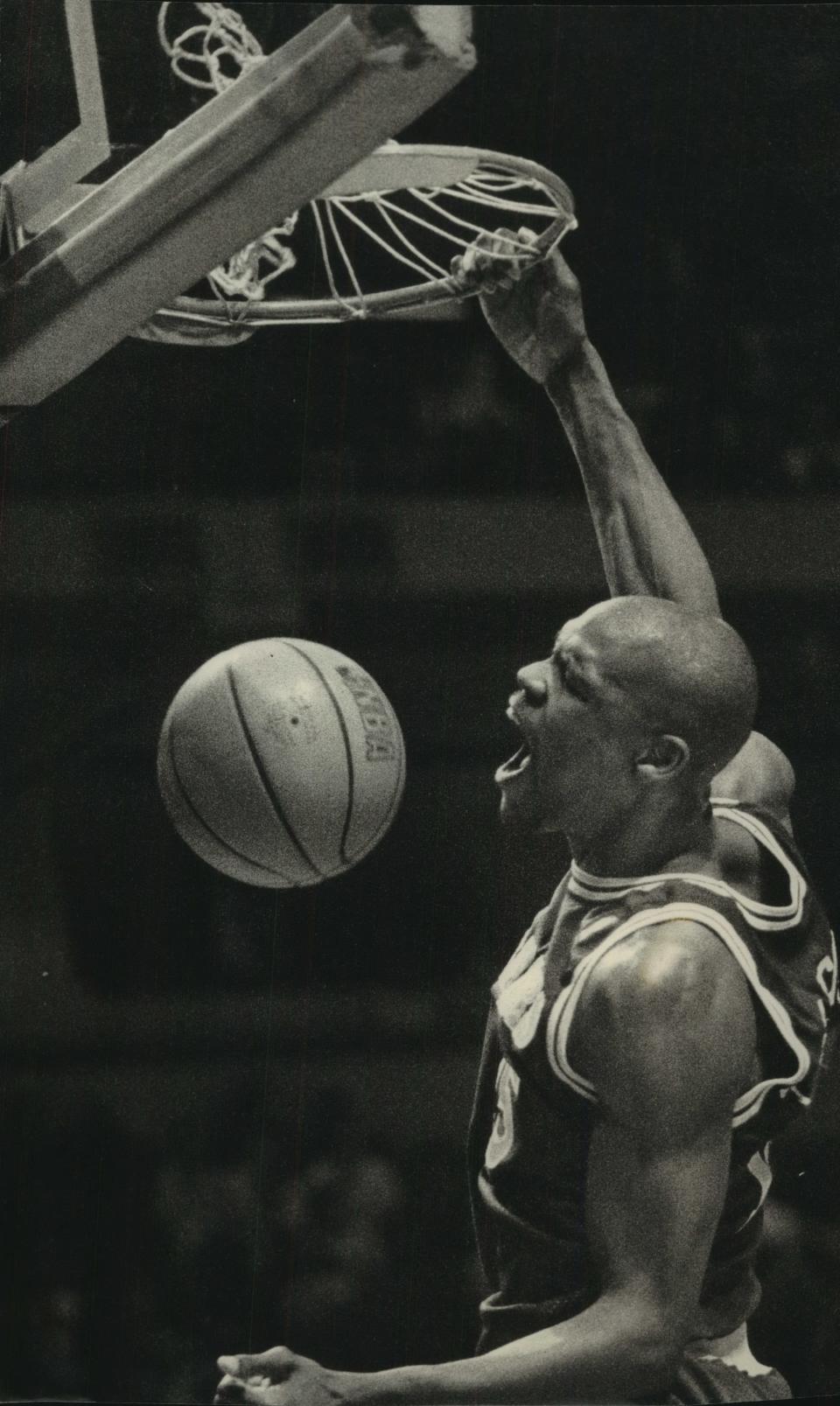Golden State's Latrell Sprewell dunks against the Bucks at the Bradley Center in 1994.
