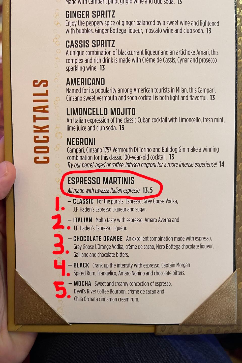 Menu page with various cocktails listed including ingredients and prices, person's finger pointing at an option