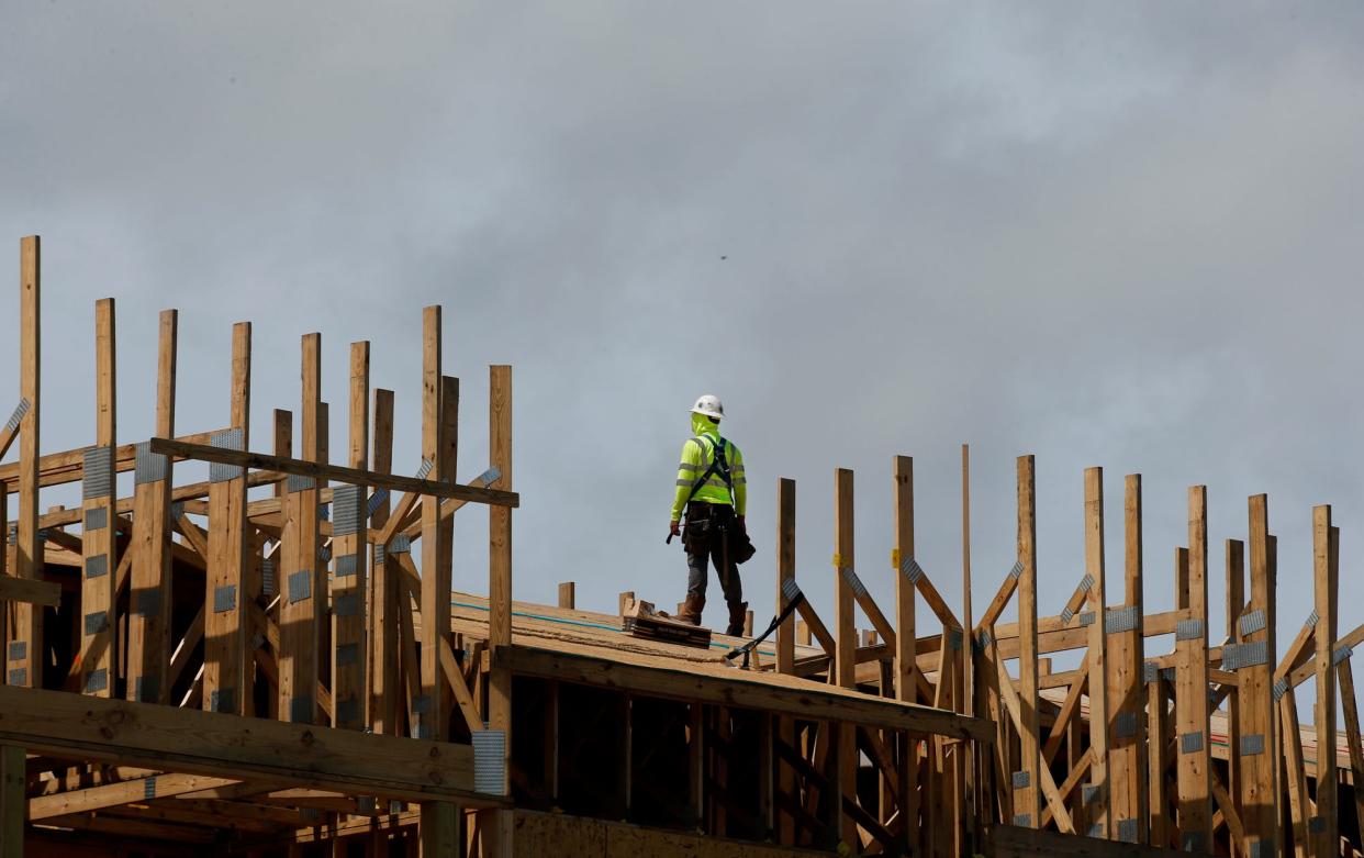 Construction workers work in the heat of the midday sun in Daytona Beach, Tuesday, Sept 14, 2021.