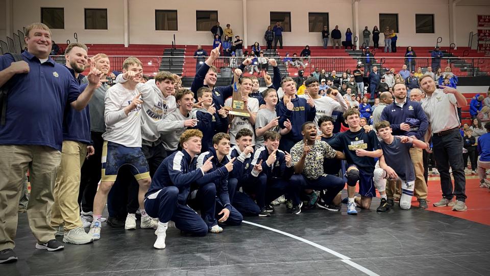 Delaware Military poses for a team photo after winning the 2024 DIAA Division II wrestling team title at Smyrna High on Feb. 17, 2024.
