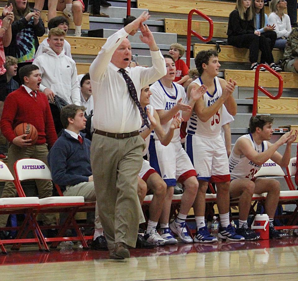 Martinsville coach Kip Staggs calls a timeout after a 3-pointer during Saturday's home game against Columbus North. 