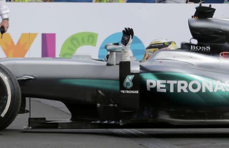 Formula One - F1 - Mexican F1 Grand Prix - Mexico City, Mexico - 30/10/16 - Mercedes' Lewis Hamilton of Britain waves as he celebrates his race victory. REUTERS/Henry Romero