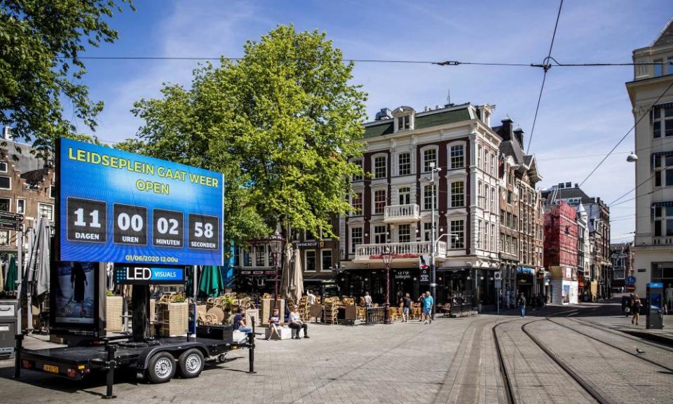 A sign in Amsterdam’s Leidseplein counting the days until bar terraces are allowed to reopen.