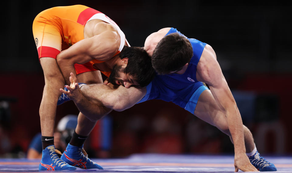 CHIBA, JAPAN - AUGUST 5, 2021: Indias Kumar Ravi (L) and ROC's Zaur Uguev fight in the men's freestyle 57kg final wrestling bout at the 2020 Summer Olympic Games, at the Makuhari Messe convention center. Stanislav Krasilnikov/TASS (Photo by Stanislav Krasilnikov\TASS via Getty Images)