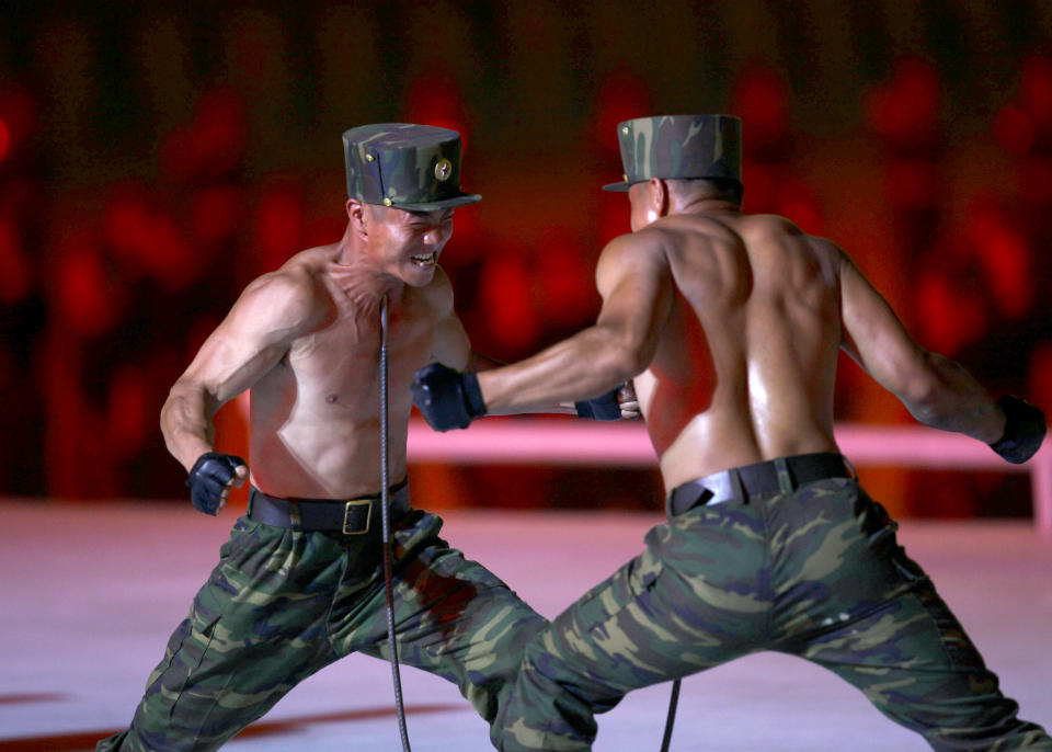 North Korean soldiers show their skills during a mass game performance of "The Land of the People" at the May Day Stadium in Pyongyang, North Korea, Tuesday, June 25, 2019. (AP Photo/Cha Song Ho)