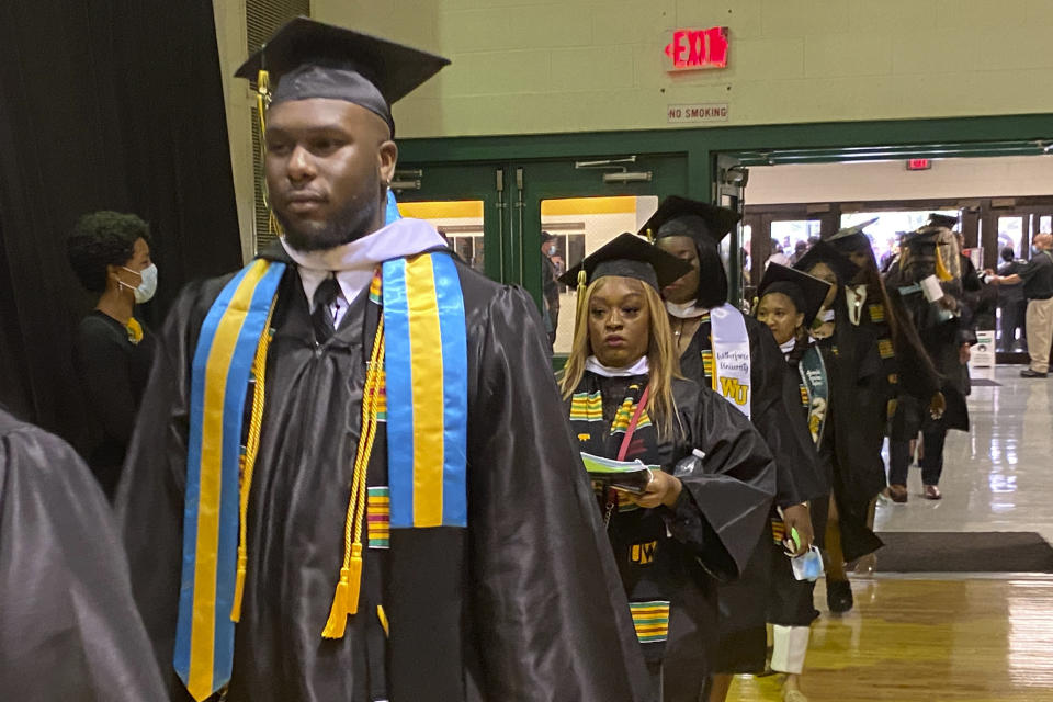 Participants in Wilberforce University's May, 2022, commencement walk through the school in Wilberforce, Ohio. Historically Black colleges and universities, which had seen giving from foundations decline in recent decades, have seen an increase in gifts particularly from corporations and corporate foundations over the last several years. (Marsha Bonhart, Wilberforce University via AP)